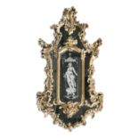 A 19TH VENETIAN GILTWOOD COMPARTMENTAL WALL MIRROR, of cartouche form, the central panel etched