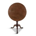 A GEORGE III MAHOGANY CIRCULAR SUPPER TABLE, the revolving plain top on a bird-cage action and