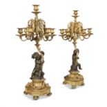 A PAIR OF 19TH CENTURY FRENCH ORMOLU AND BRONZE FIGURAL CANDELABRA, the seven sconces supported