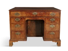 AN IRISH GEORGE III MAHOGANY KNEEHOLE DESK/DRESSING TABLE, dated 1772, signed by Edward Croby,