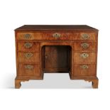 AN IRISH GEORGE III MAHOGANY KNEEHOLE DESK/DRESSING TABLE, dated 1772, signed by Edward Croby,