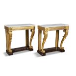 A PAIR OF WILLIAM IV GILTWOOD CONSOLE TABLES, the moulded friezes raised on leaf carved scroll