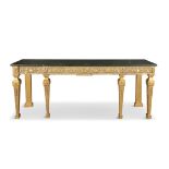 A GEORGE III STYLE GILTWOOD AND GESSO LONG RECTANGULAR TABLE, the faux black marble top above a