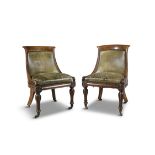 A PAIR OF GEORGE IV MAHOGANY FRAMED LIBRARY CHAIRS, the tub shaped backs and seats upholstered in