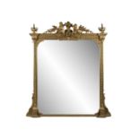 A VICTORIAN GILTWOOD AND GESSO OVERMANTLE MIRROR, the leaf and berry moulded cornice surmounted