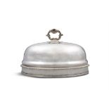 A LARGE EARLY 19TH CENTURY SILVER PLATED DOMED DISH COVER, of oval form, having cast ring handle
