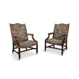 A PAIR OF MAHOGANY FRAMED GAINSBOROUGH ARMCHAIRS, each covered in a floral patterned fabric,