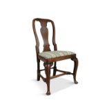 A GEORGE I WALNUT SIDE CHAIR, the open back with vase shaped splat, drop in upholstered seat on
