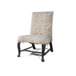 AN IRISH MAHOGANY FRAMED UPHOLSTERED PARLOUR CHAIR c.1750, the upright back above a wide