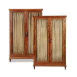 A PAIR OF EARLY 20TH CENTURY SATIN BIRCH FRENCH TWO DOOR CABINETS, with brass grills.