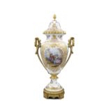A 19TH CENTURY CONTINENTAL PORCELAIN ORMOLU VASE AND COVER, signed Wattaux, of baluster form,