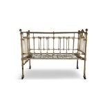A 19TH CENTURY BRASS AND METAL NURSERY BED, on castors. 64 x 123cm high