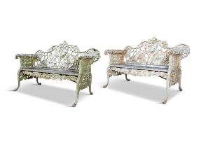 A FINE PAIR OF VICTORIAN CAST IRON GARDEN BENCHES, attributed to Coalbrookdale,