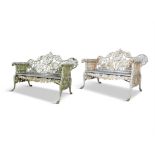 A FINE PAIR OF VICTORIAN CAST IRON GARDEN BENCHES, attributed to Coalbrookdale,