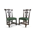 A PAIR OF IRISH MAHOGANY SIDE CHAIRS, c.1760, the carved, scrolled and moulded crest rail centred