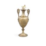 'THE BARRISTER'S CUP' A Victorian silver gilt ewer shaped trophy and cover, London c.1861,