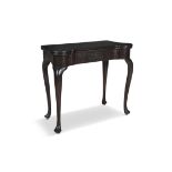 AN IRISH GEORGE III MAHOGANY FOLDING TOP CARD TABLE, the top with circular candle stands and