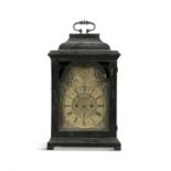 A GEORGE III EBON CASED MANTLE CLOCK, the arched domed top with brass carrying handle,