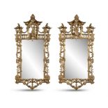 A PAIR OF GEORGE III STYLE GILTWOOD WALL MIRRORS IN CHINESE CHIPPENDALE MANNER, the well carved