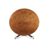 AN IRISH REGENCY CIRCULAR MAHOGANY DINING TABLE, the plain figured top composed of a single