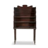 AN IRISH REGENCY MAHOGANY OPEN BOOKCASE, CIRCA 1815, with shaped cresting over four open shelves