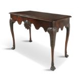 AN IRISH GEORGE II STYLE MAHOGANY CONSOLE TABLE, 19TH CENTURY the moulded top with re-entrant