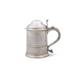 A QUEEN ANNE BRITANNIA STANDARD SILVER TANKARD, London possibly 1700, maker's mark *E* (both