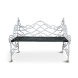 A 19TH CENTURY CAST IRON COALBROOKE DALE STYLE TWO SEAT GARDEN BENCH, the naturalistic cast