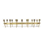 CANDLE HOLDER A brass centre table fourteen piece candle holder. c.1950. 73 x 26 x 15 (h)
