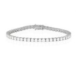 A DIAMOND LINE BRACELET The continuous row of brilliant-cut diamonds within claw-setting,