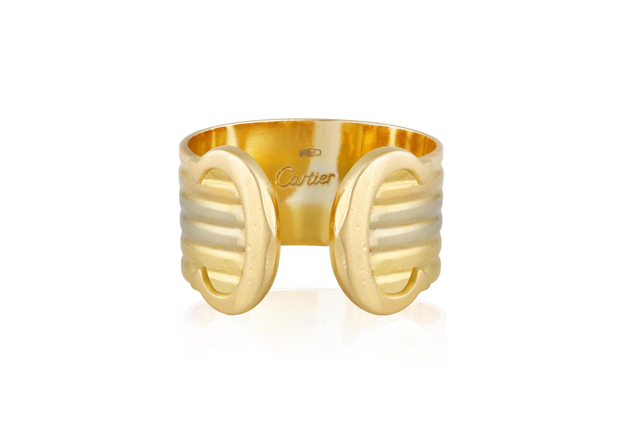 A GOLD 'C DE CARTIER' RING, BY CARTIER Designed as a tri-colour gold band with two 'C' terminals,