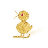 A RUBY AND GOLD NOVELTY BROOCH, BY MELLERIO, CIRCA 1960 The whimsical chick perched on its