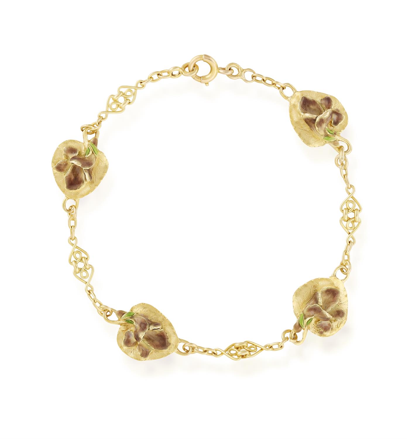 AN ART NOUVEAU ENAMEL BRACELET, CIRCA 1905 The fancy-link chain interspersed by four leaves with