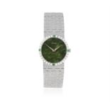 AN ELEGANT 18K GOLD, DIAMOND AND EMERALD-SET BRACELET WATCH WITH JADE DIAL, BY PIAGET,