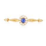 A SAPPHIRE AND DIAMOND BROOCH The oval-shaped sapphire within a rose-cut diamond frame between