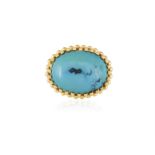 A TURQUOISE DRESS RING, ITALIAN, CIRCA 1960 The oval-shaped cabochon turquoise at the centre