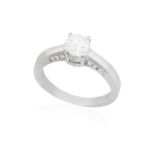 A DIAMOND SINGLE-STONE RING The round brilliant-cut diamond weighing 0.59ct within a four-claw