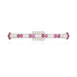 AN EARLY 20TH CENTURY RUBY AND DIAMOND BAR BROOCH Designed as a line of circular-cut rubies and
