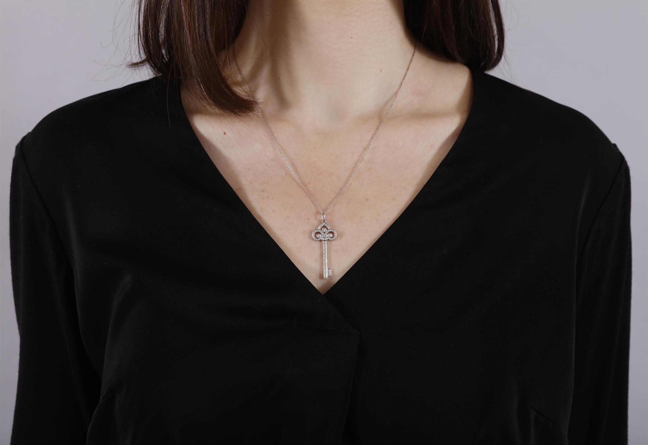 A DIAMOND 'FLEUR DE LIS' PENDANT ON CHAIN, BY TIFFANY & CO. Modelled as a stylised key, - Image 4 of 5