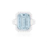 AN AQUAMARINE AND DIAMOND DRESS RING The cut-cornered step-cut aquamarine weighing approximately