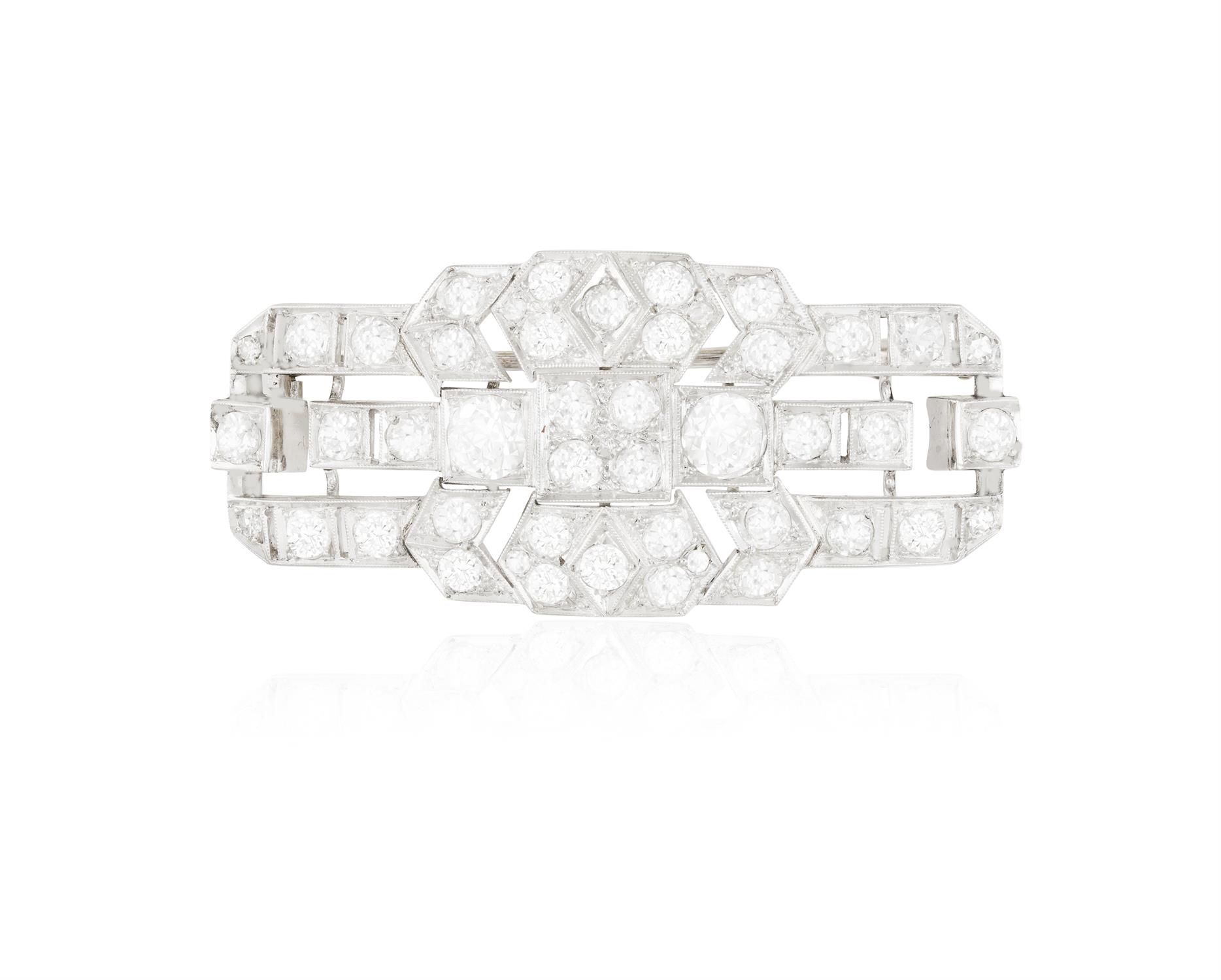 A EARLY 20TH CENTURY DIAMOND BROOCH, CIRCA 1920 Of stylised concave rectangular outline,