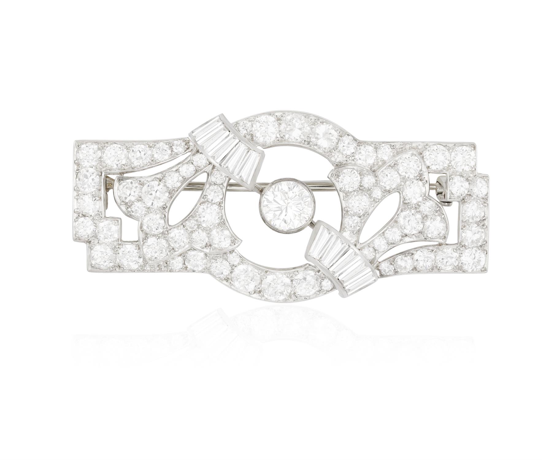 AN ART DECO DIAMOND BROOCH, CIRCA 1930 Of openwork geometric design with foliate detailing,