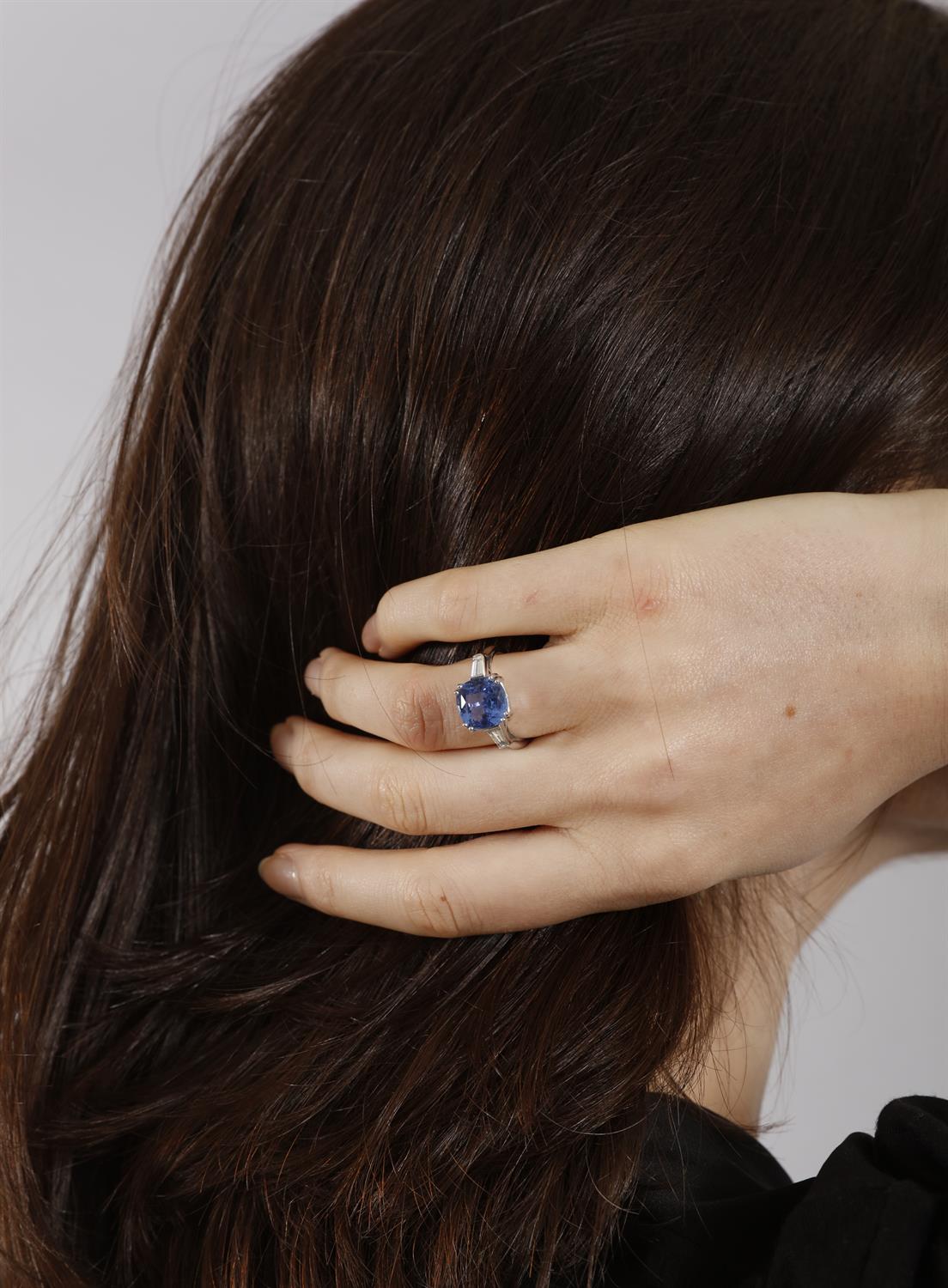 A SAPPHIRE AND DIAMOND DRESS RING The cushion-shaped sapphire weighing approximately 5. - Image 5 of 6