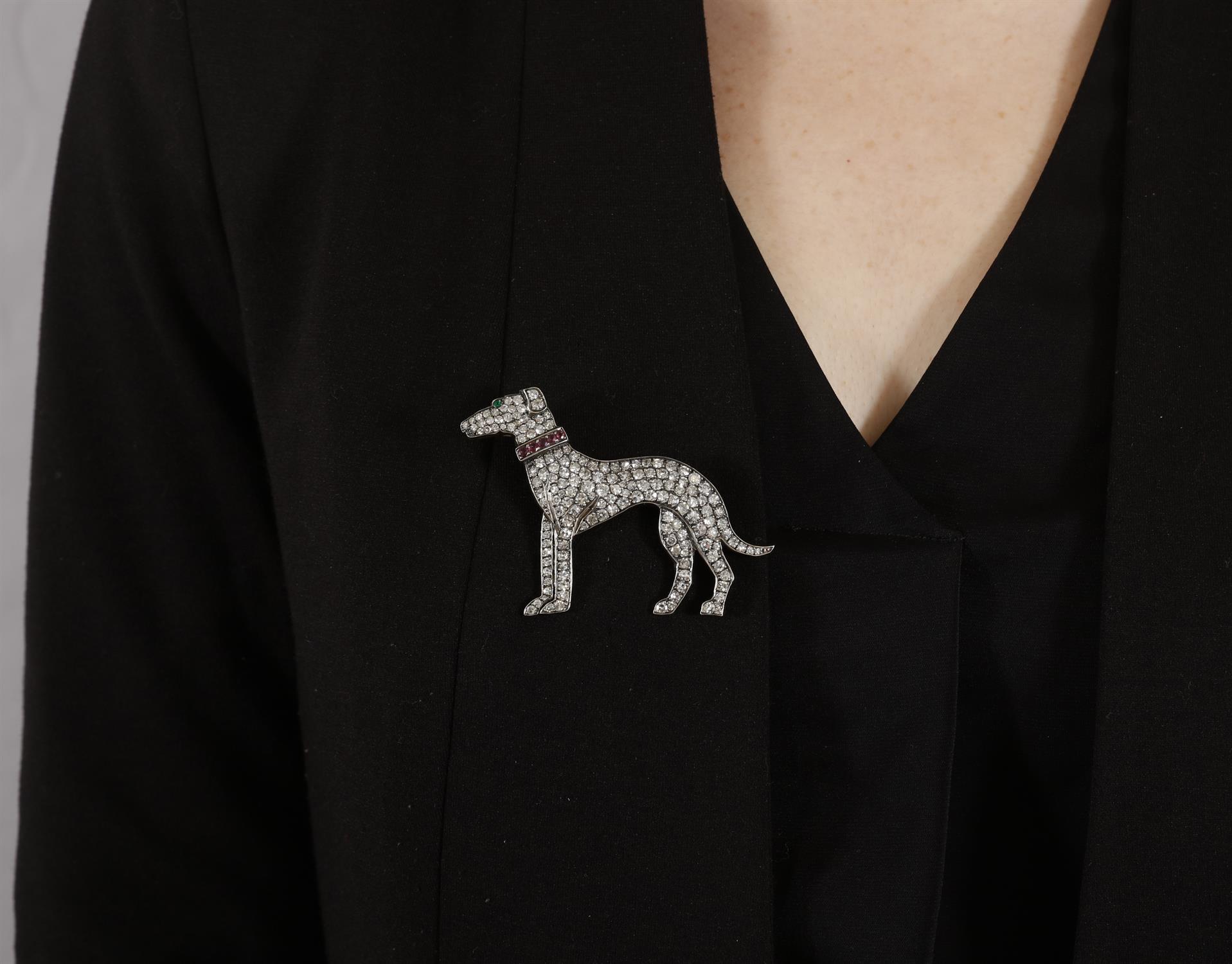 A DIAMOND, RUBY AND EMERALD NOVELTY BROOCH The stylised greyhound set throughout with single-cut - Image 3 of 4