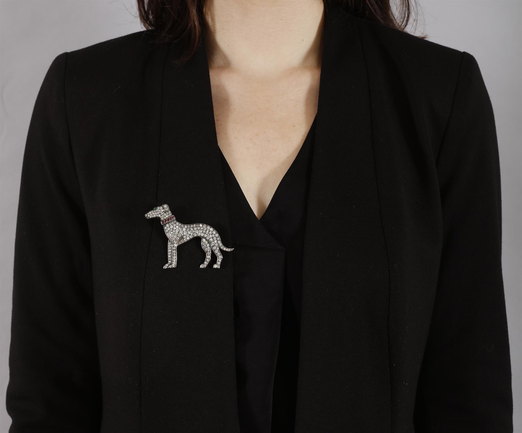 A DIAMOND, RUBY AND EMERALD NOVELTY BROOCH The stylised greyhound set throughout with single-cut - Image 2 of 4