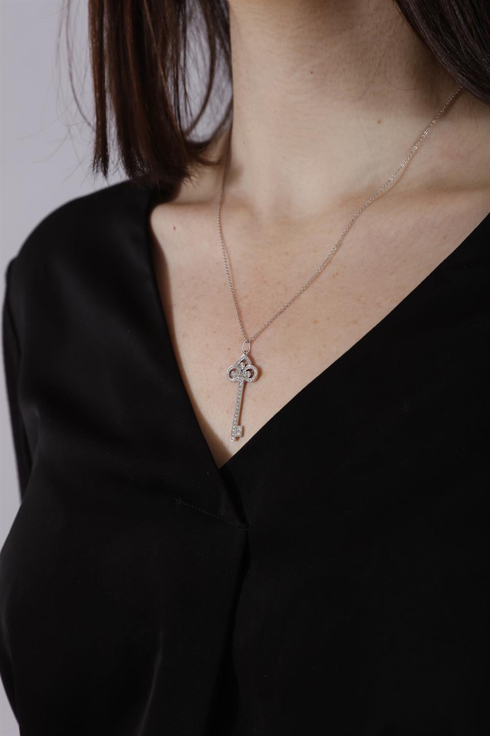A DIAMOND 'FLEUR DE LIS' PENDANT ON CHAIN, BY TIFFANY & CO. Modelled as a stylised key, - Image 5 of 5