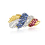 A SAPPHIRE, RUBY AND DIAMOND BROOCH Designed as a stylised shell embellished with oval-shaped