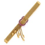 A RUBY AND GOLD SECRET BRACELET WATCH, BY UTI, CIRCA 1950 The mesh-link gold bracelet with