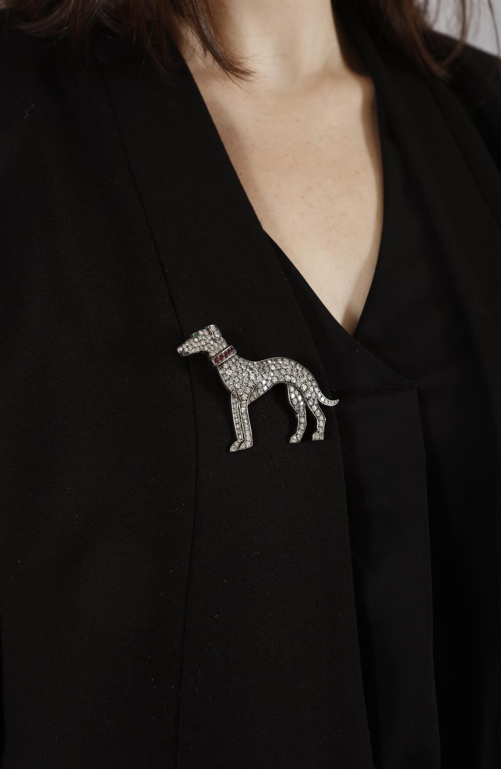 A DIAMOND, RUBY AND EMERALD NOVELTY BROOCH The stylised greyhound set throughout with single-cut - Image 4 of 4