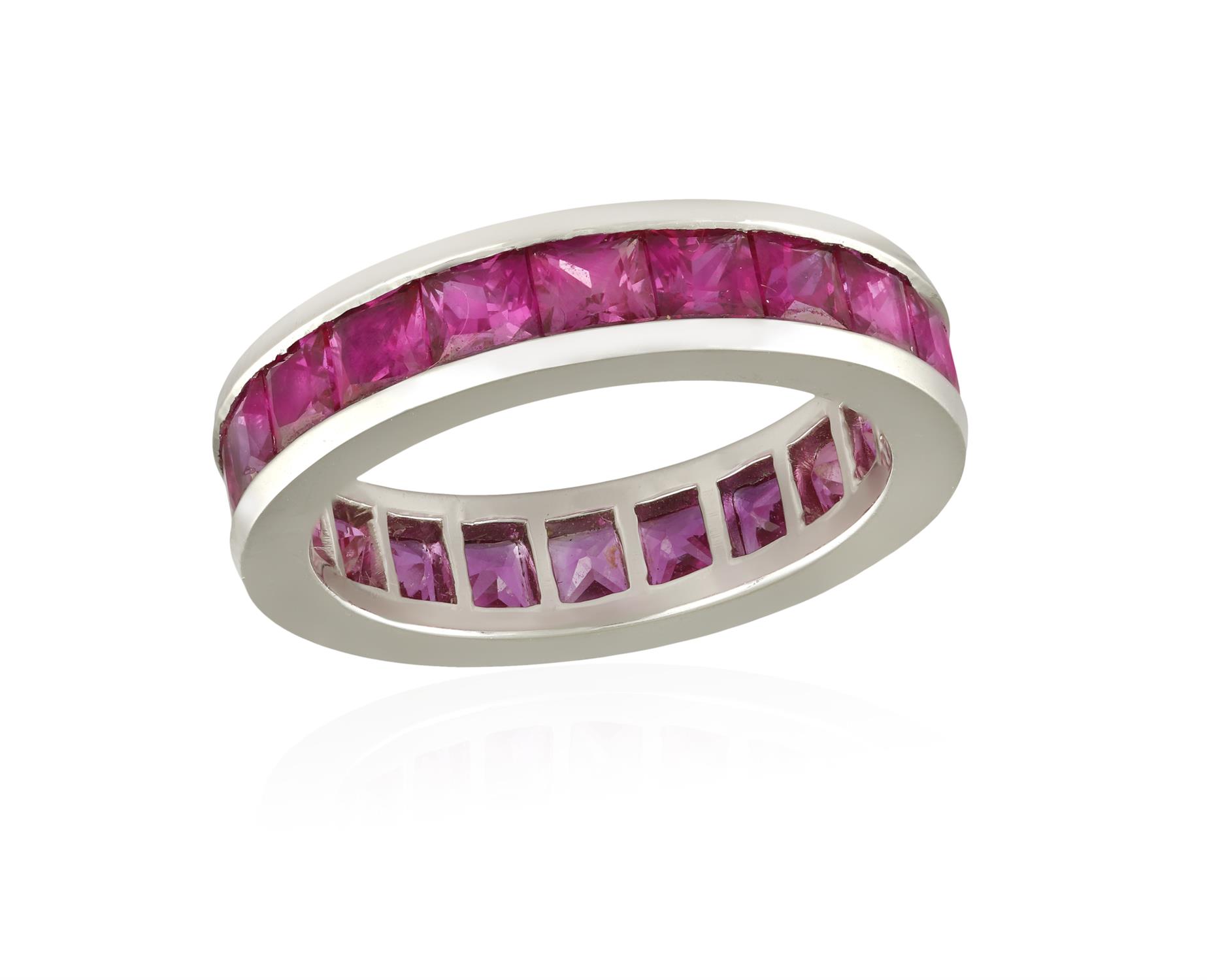 A RUBY ETERNITY RING, BY GRAFF The continuous row of square-cut rubies within channel-setting,